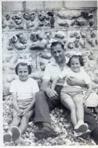 Annie (left) with her sister and father, James.